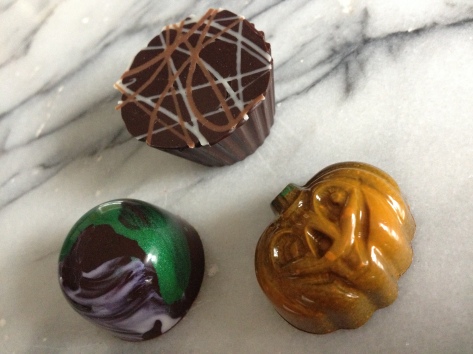 The chocolates in color, Caramel Apple bottom left, Nutty fluff top right, Pumpkin spice bottom right